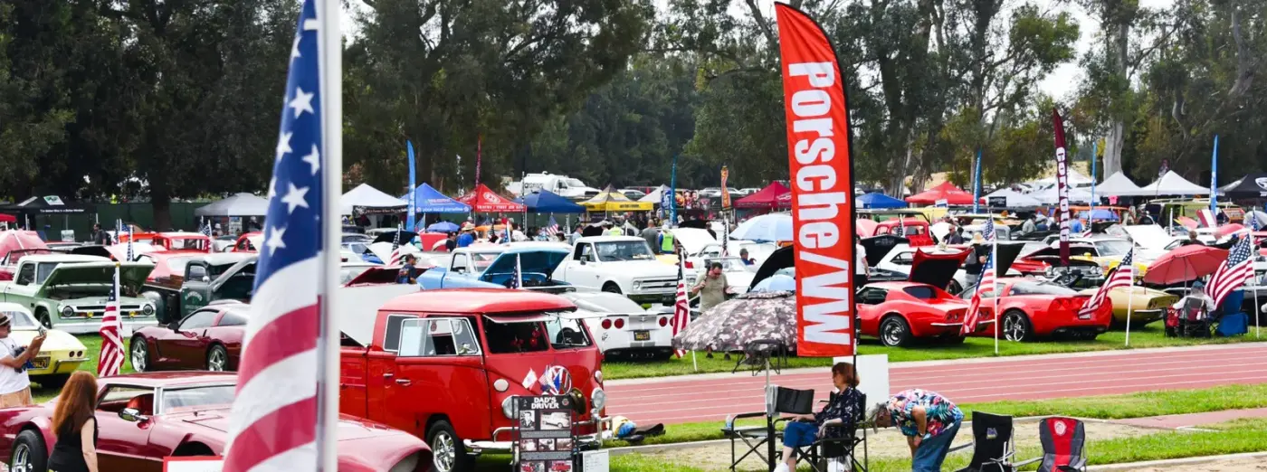Classic cars and flags at a Boys Republic car show