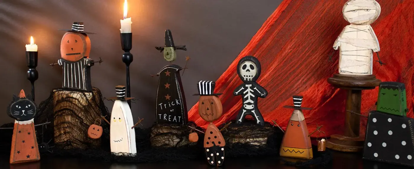 Primitive folk-art Halloween figures and candles